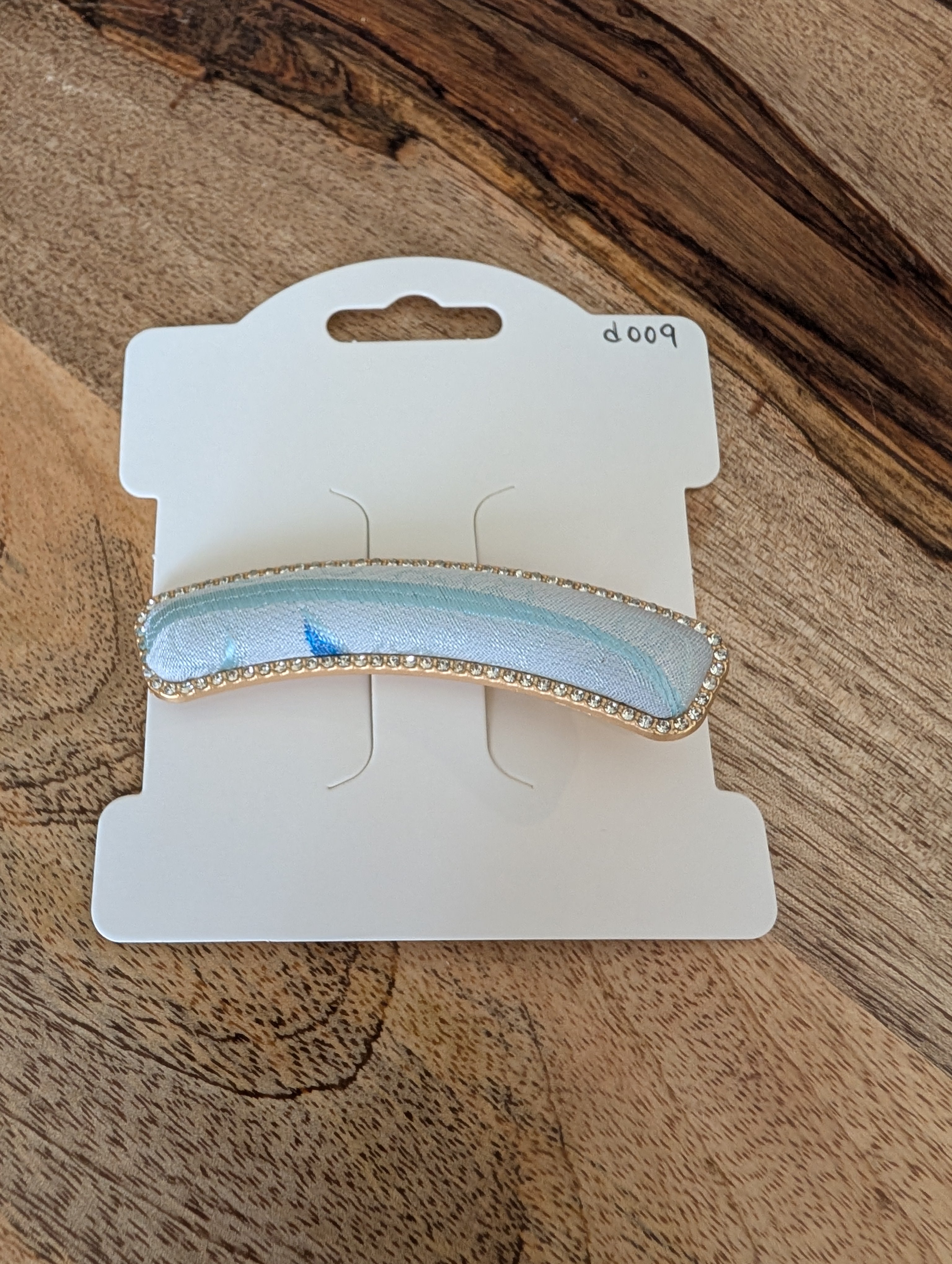 D009 - Baby Blue Song Brocade barrette on packaging card
