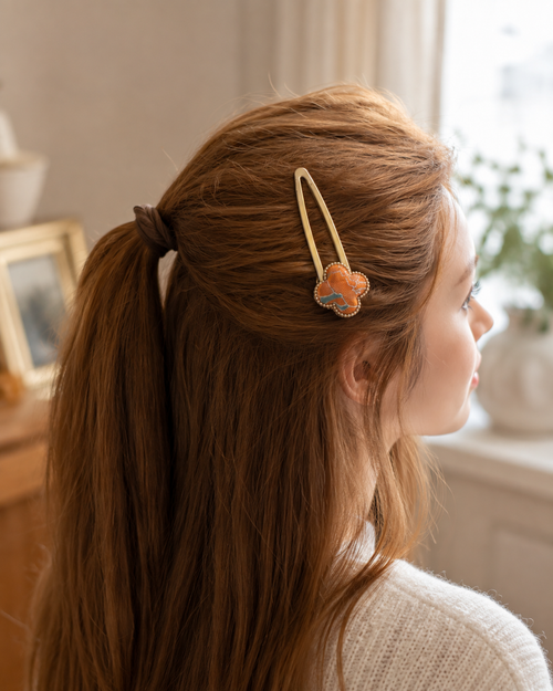 Song Brocade four-leaf clover hair clip worn in half-up style