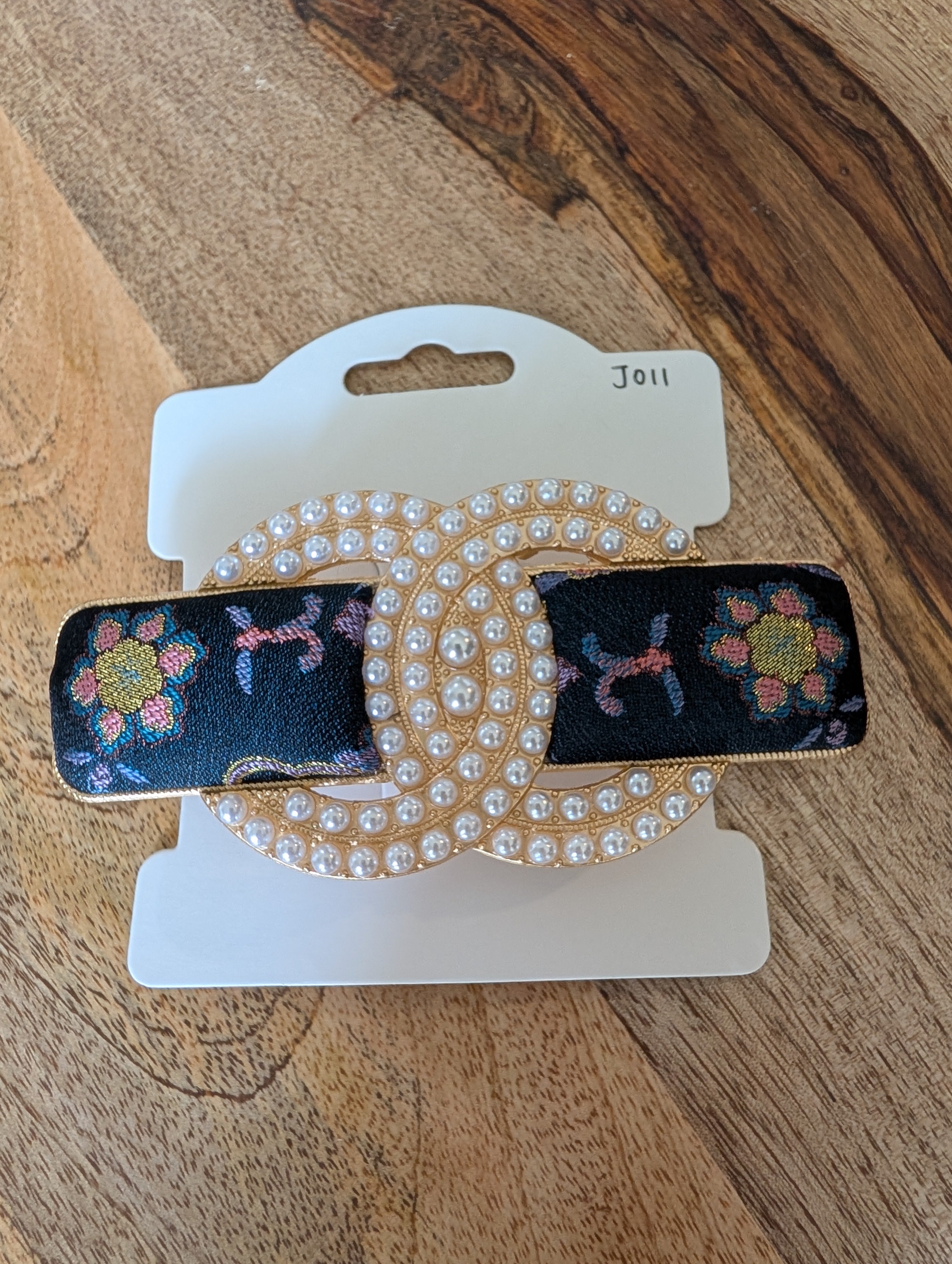 Song Brocade pearl double-C hair clip worn in ponytail