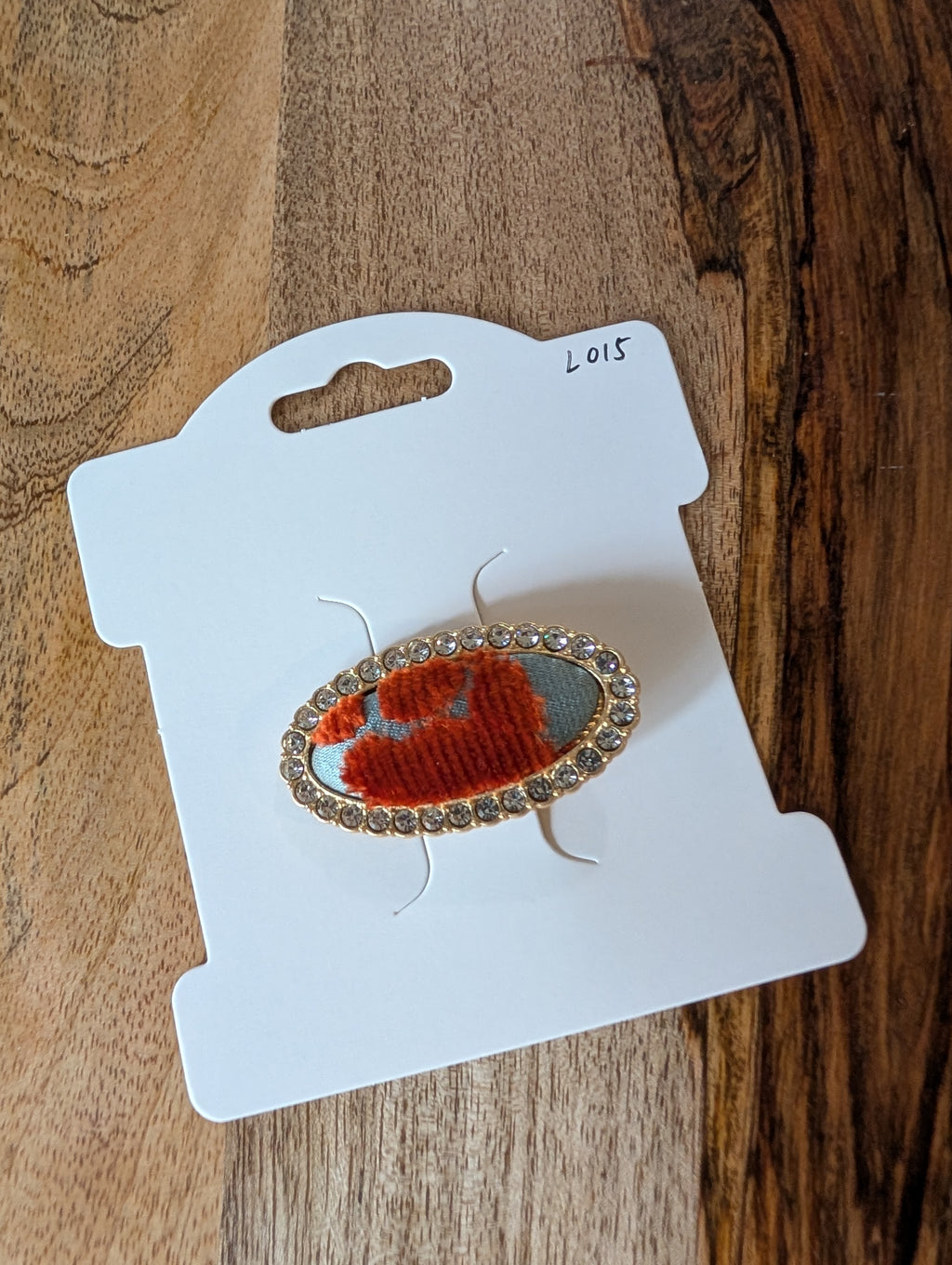 L015 - Blue-grey & red Song Brocade oval crystal hair clip on packaging card